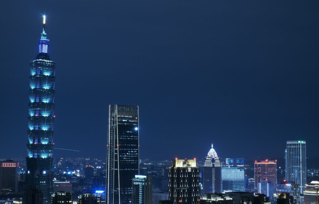 Taipei 101 tower illuminated at night with city skyline